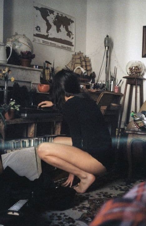 girl playing music in her living room