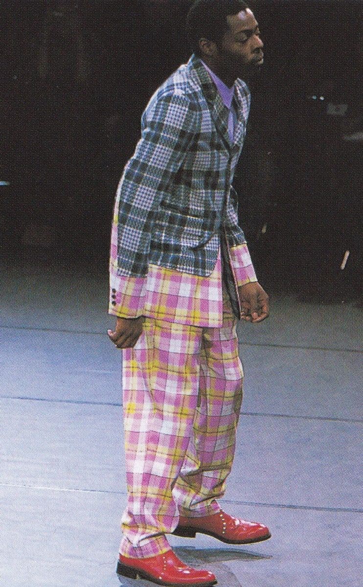 funky dude in a 2 color plaid suit